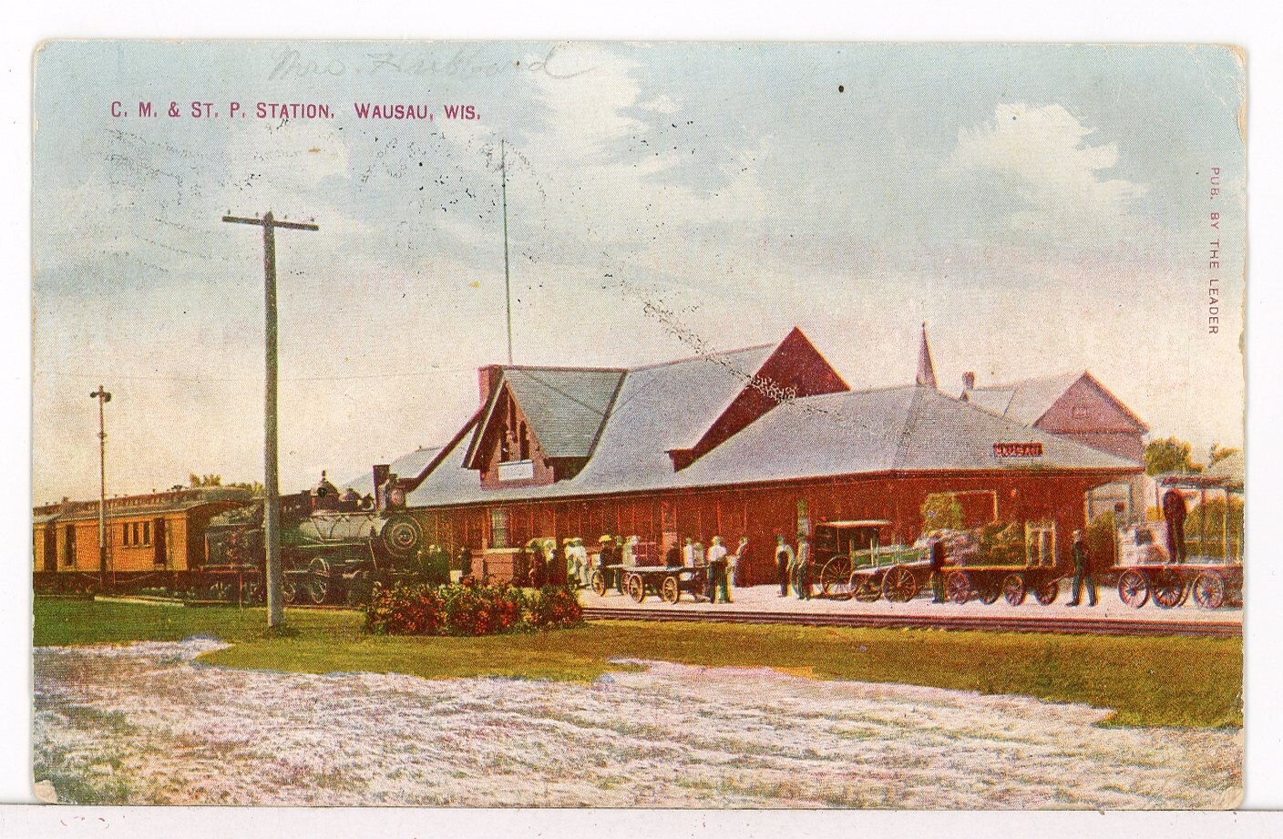 1909 – Chicago, Milw. & St. Paul Depot and Train, Wausau WI Railroad Postcard