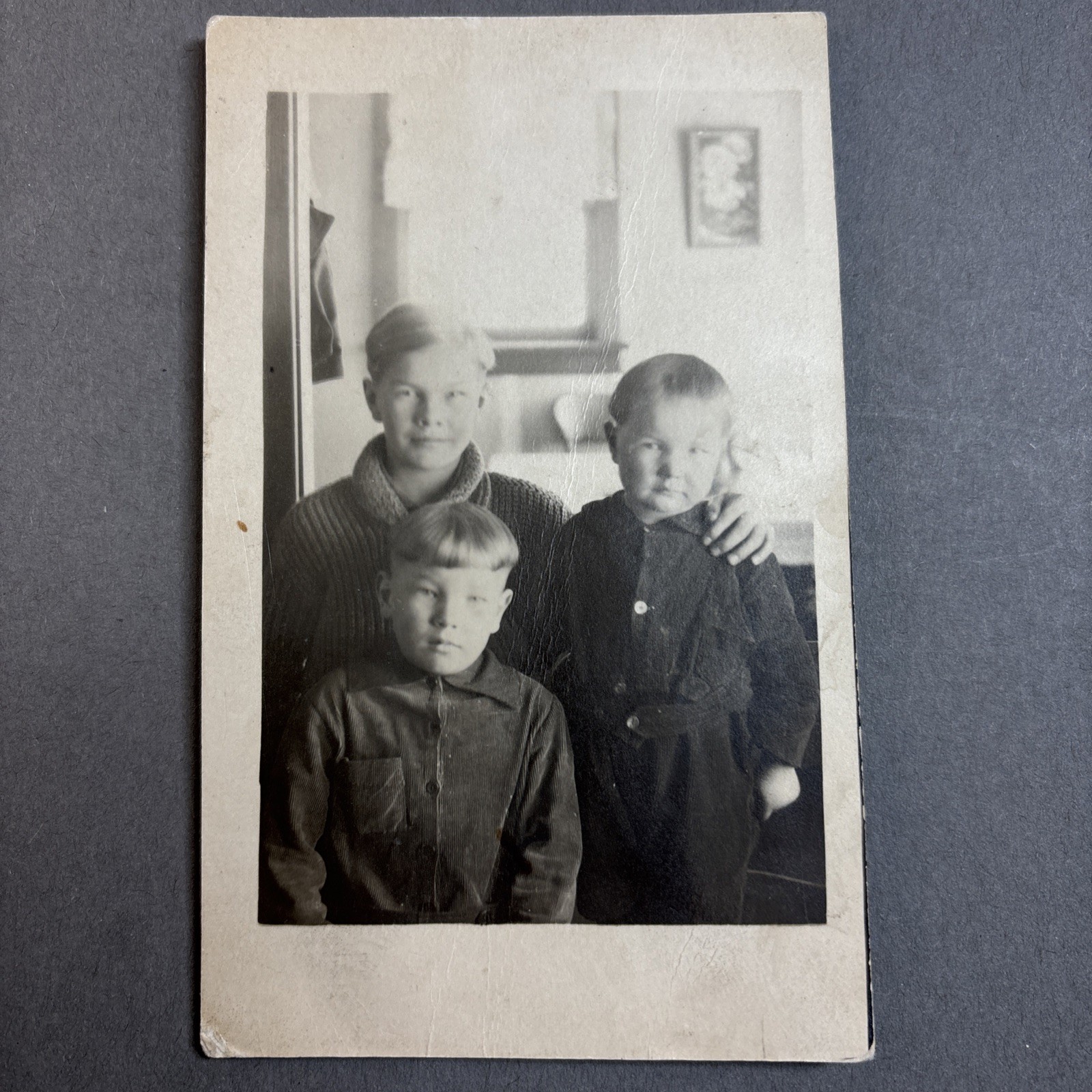 RPPC Three young boys brothers with varying haircuts incl bowl cut. unp