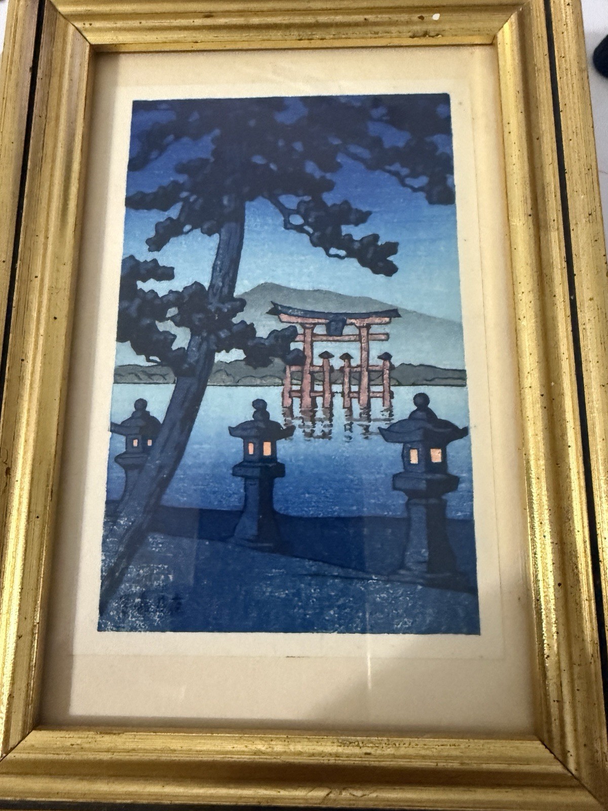 “Miyajima no Tsukiyo”. famous torii gate of Miyajima shrine at a moon-lit night.
