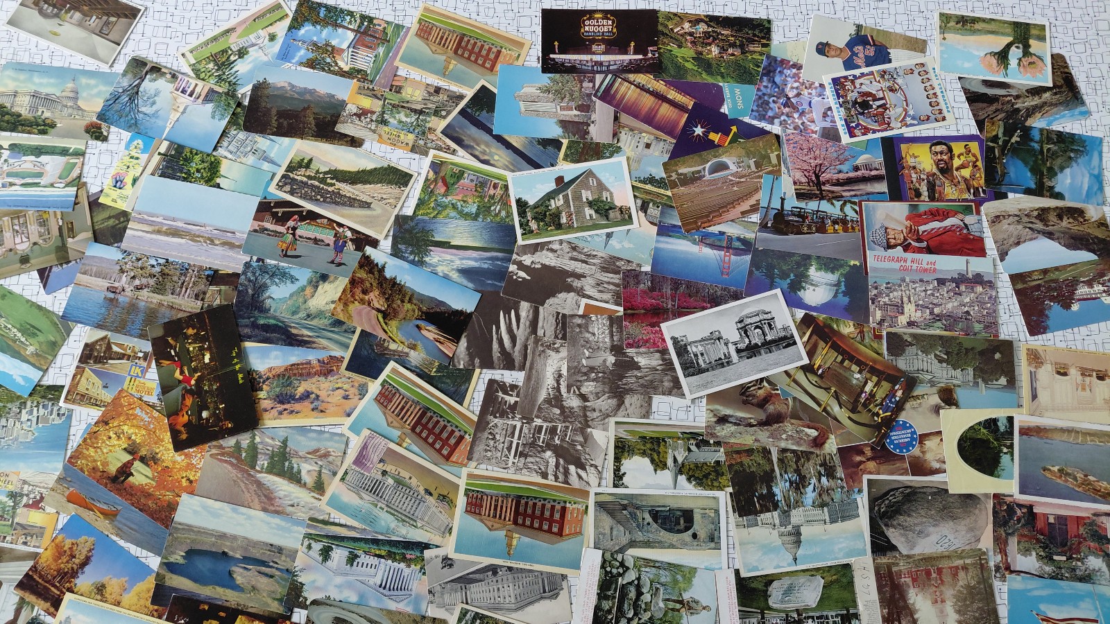 Lot of 1000 postcards (approx) ALL USA TOWN VIEWS standard size ALL AGES v9102