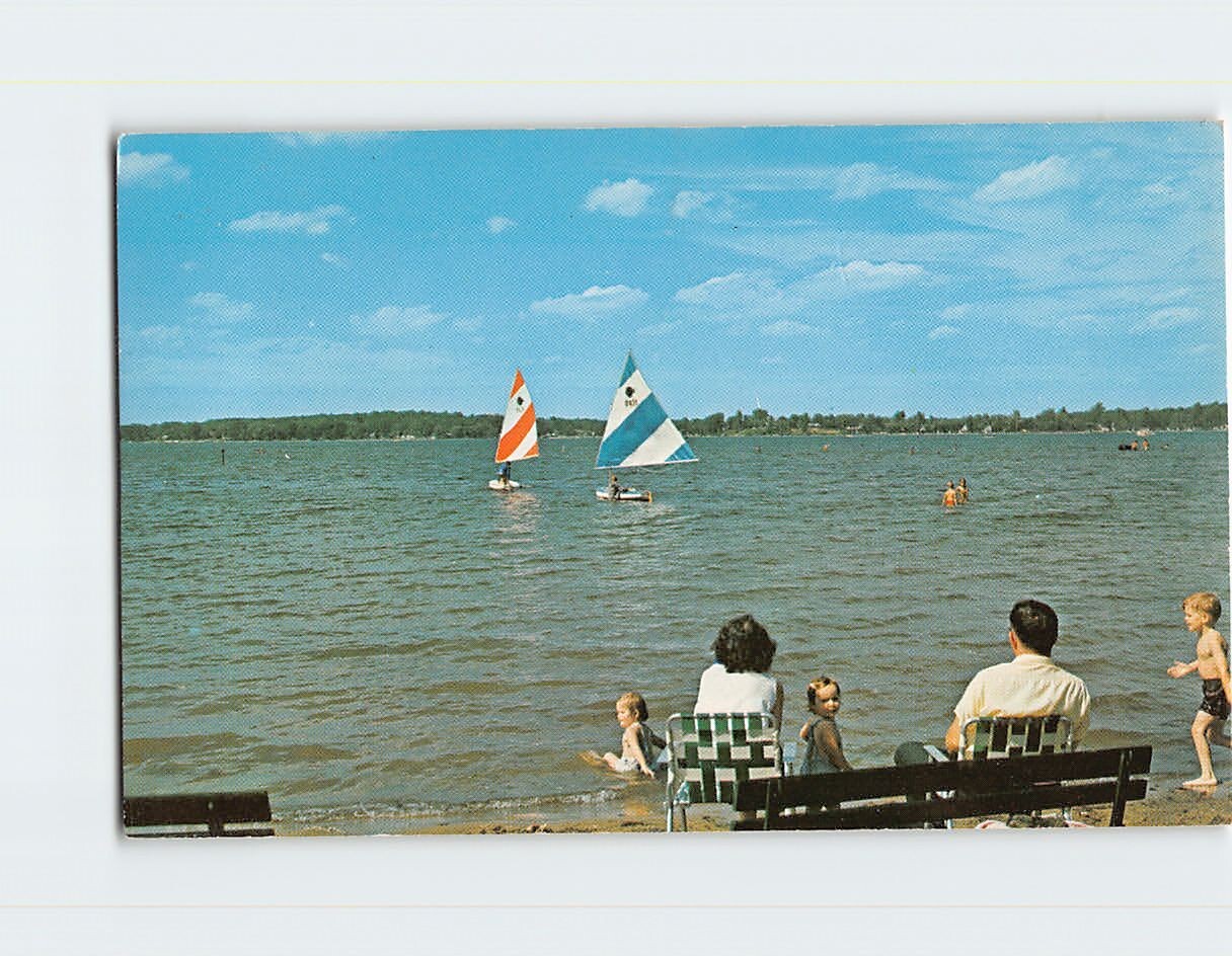 Postcard Relaxing with the family & watching colorful sailing boats