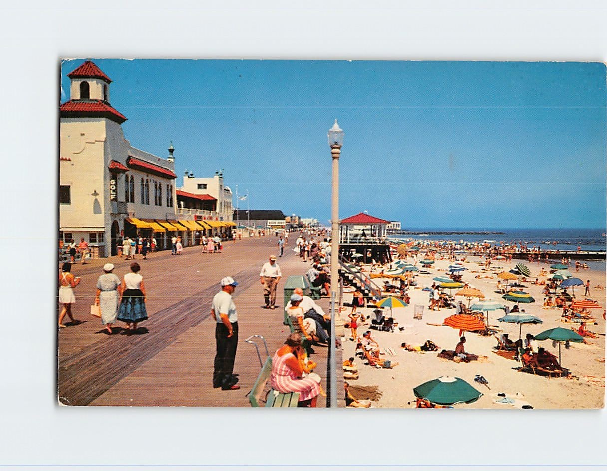 Postcard A view of their famed beach and boardwalk Ocean City New Jersey USA