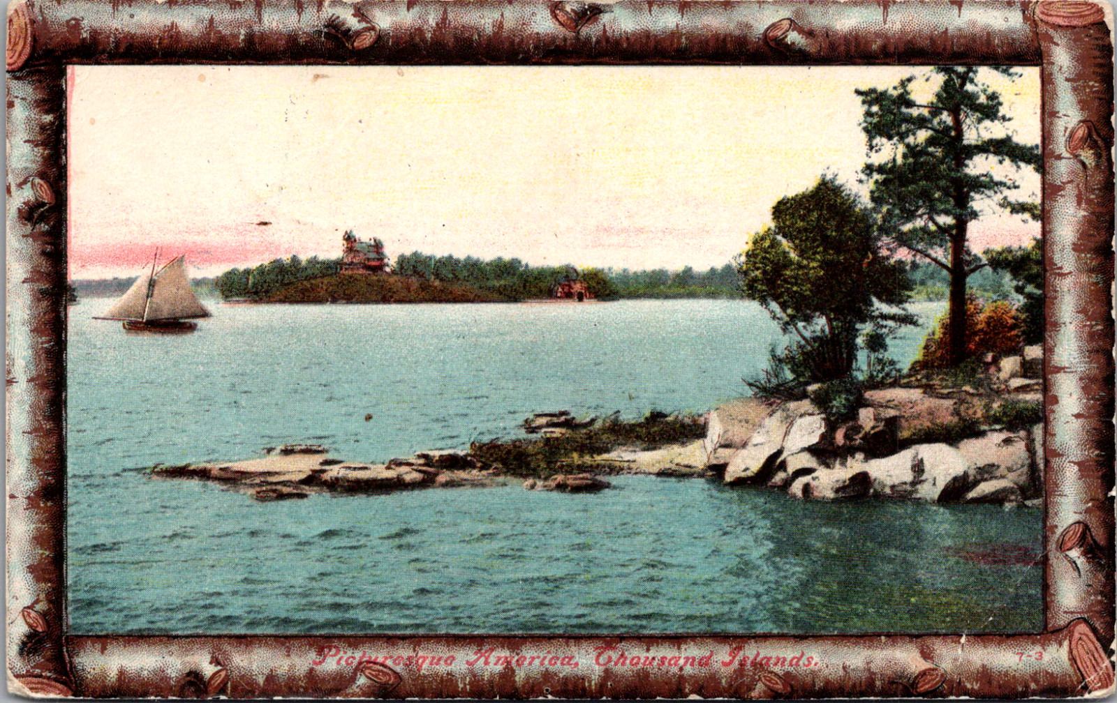 Rocky Beach on a Lake with Sailboat Branch Frame Postcard