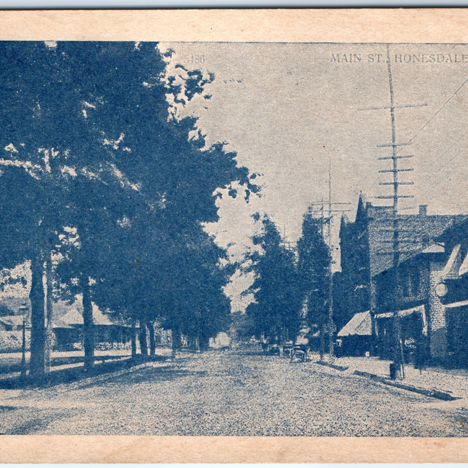 c1910s Honesdale, PA Main Street Blue Litho Postcard Telegraph Poles Downtown
