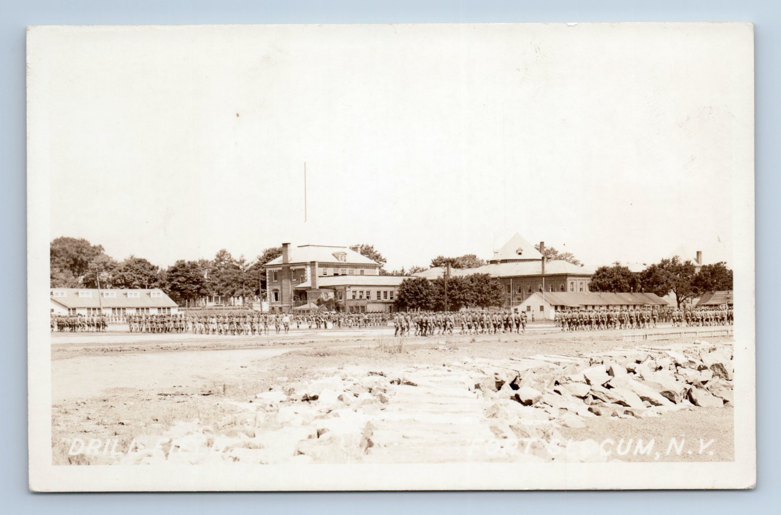 c.1940 Fort Slocum NY RPPC Drill Field Military Soldiers Marching Buildings VTG